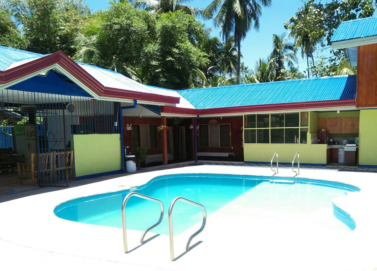 Standard Family Room exterior with pool — Villa Corrales