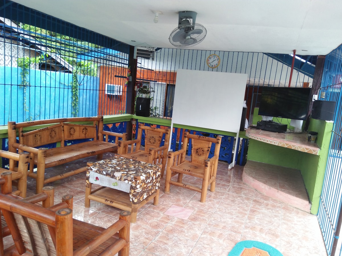 Superior Family Room lounge and terrace area at Villa Corrales